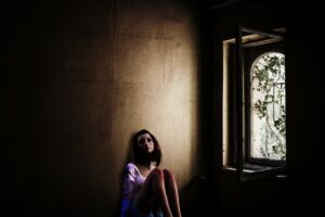girl sitting in fear